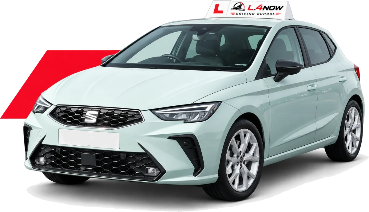 The L_4NOW car: a dual-controlled manual hatchback with L plates and a roof sign.
